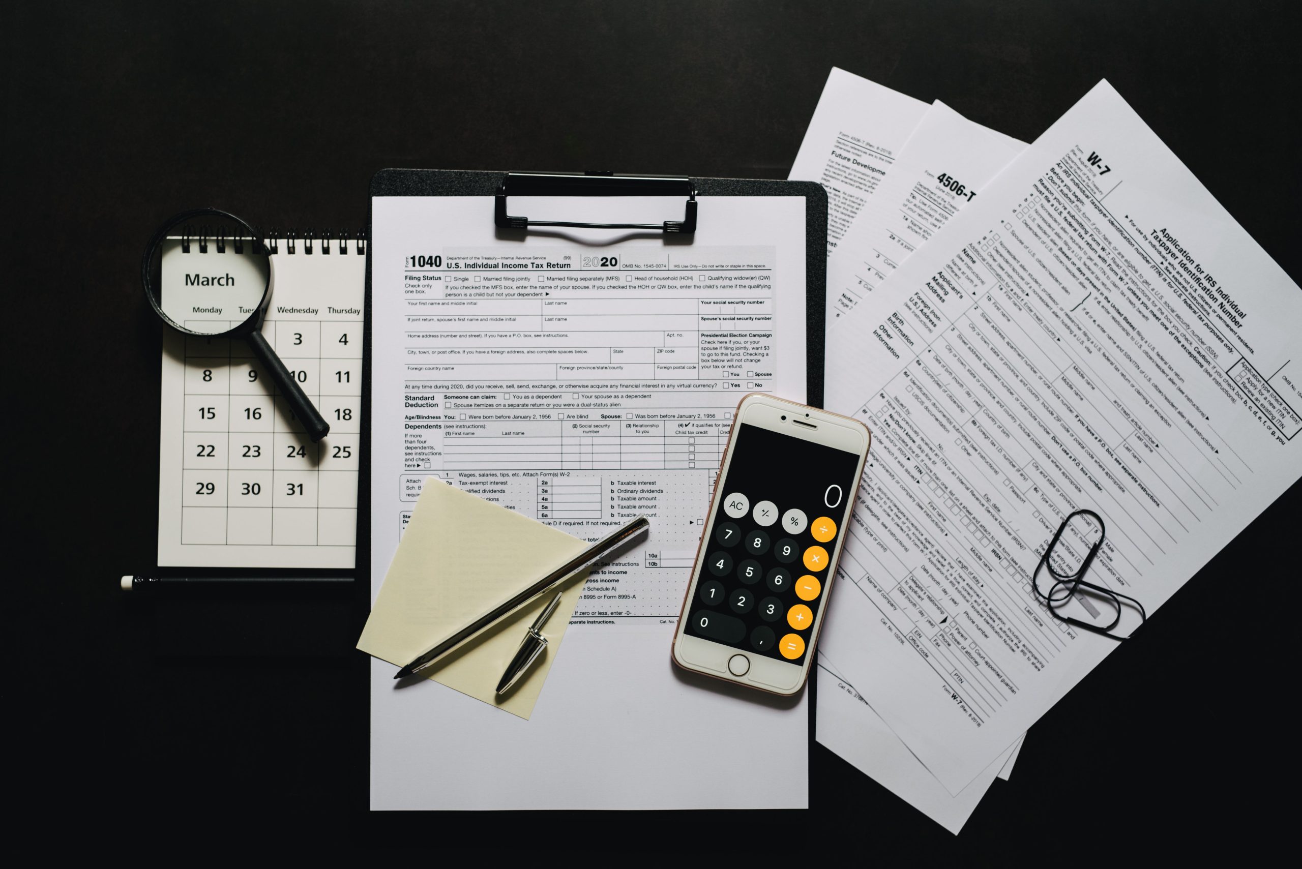 Tax filing forms, calculator, and calendar for March at Wozny Tax & Accounting Co. in Mokena, IL. Expert IRS deadline preparation services.