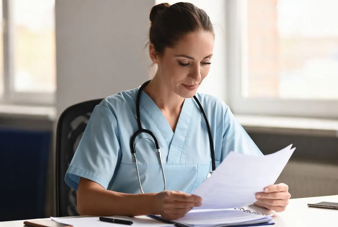 Nurse reviewing tax documents for professional tax preparation services in Mokena, IL