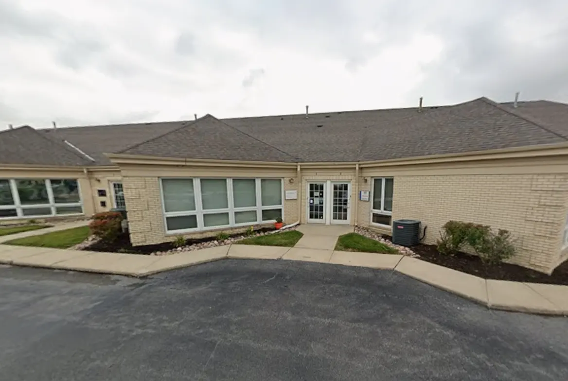 Exterior of a professional office building with suite signage visible on a clear day in Mokena Illinois